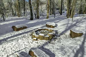 View of yard covered in snow