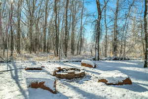 View of yard covered in snow