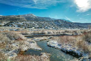 View of mountain background featuring a nearby body of water