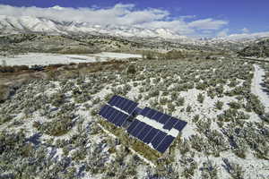 Snowy aerial view featuring a mountain view