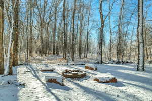 View of yard layered in snow