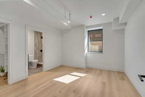 Unfurnished bedroom with light wood-style floors and recessed lighting
