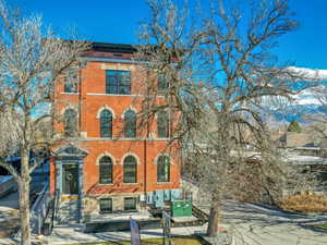 Italianate-style house featuring brick siding