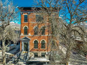 Italianate-style house with brick siding