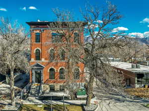 Italianate home with brick siding