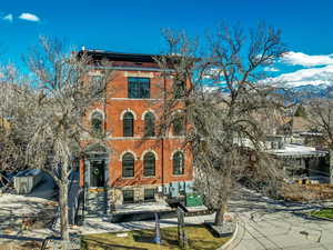 View of front facade with brick siding and a mountain view