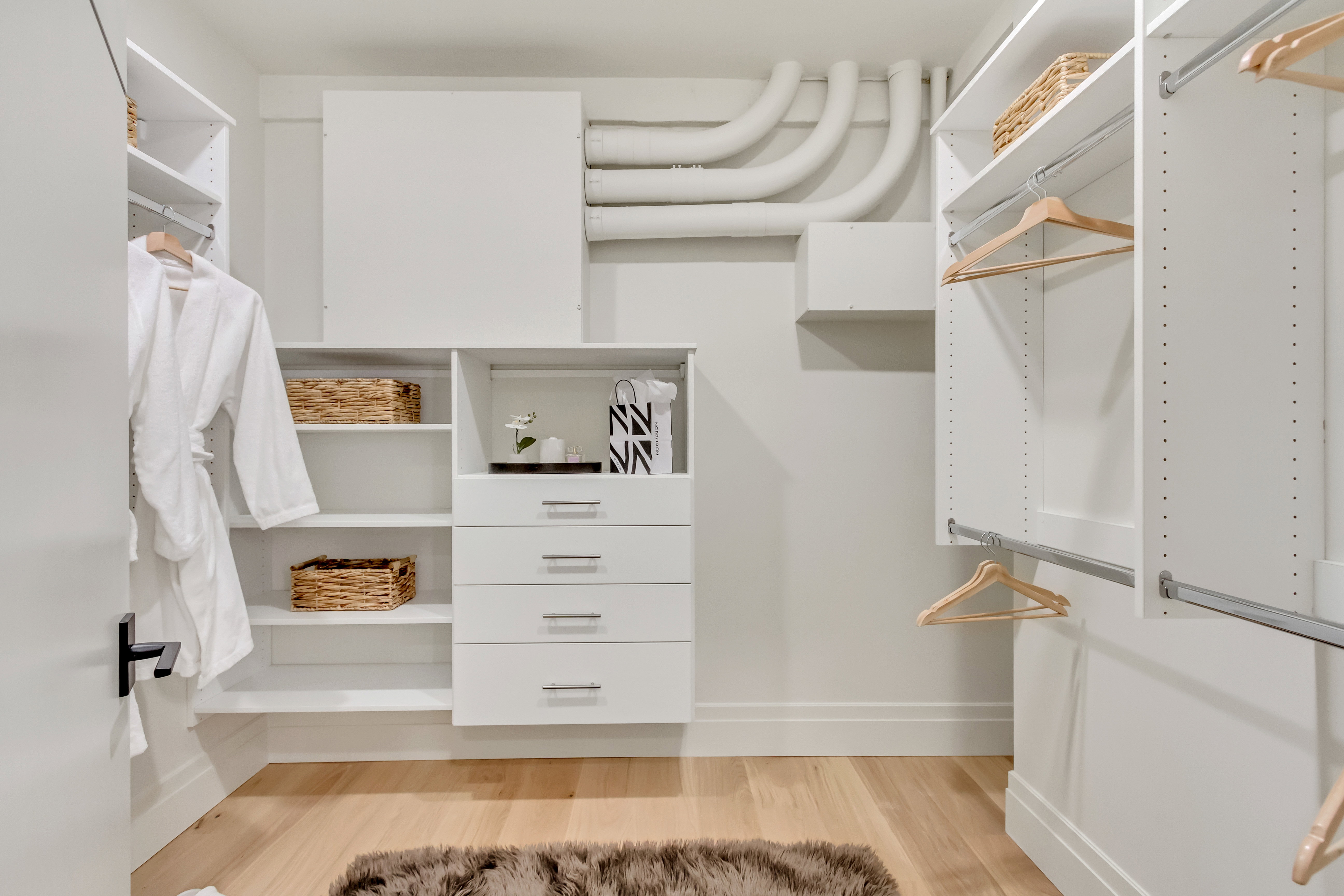 Walk in closet featuring light wood-style flooring