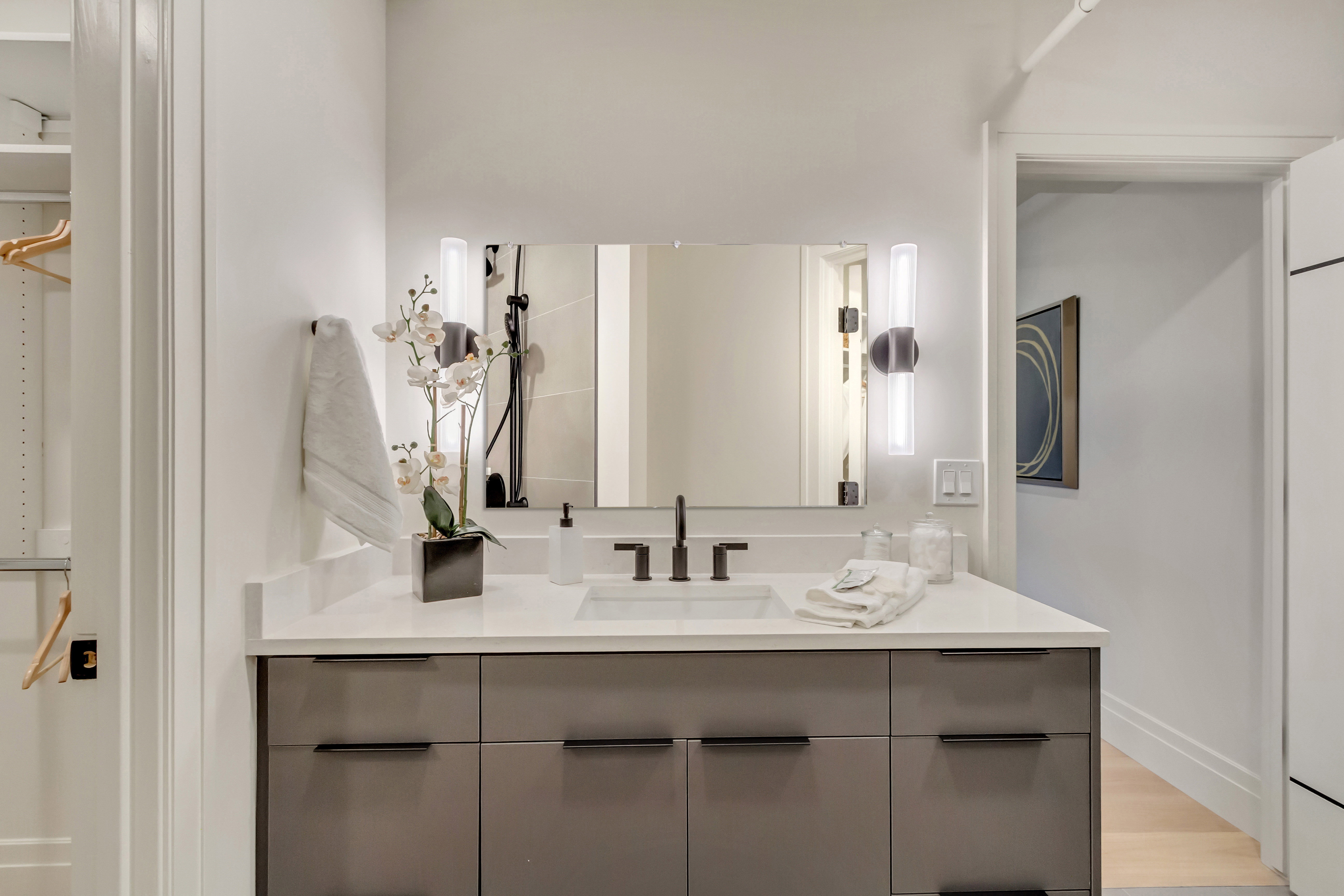 Bathroom featuring vanity and light wood-style floors