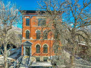 Italianate-style house with brick siding