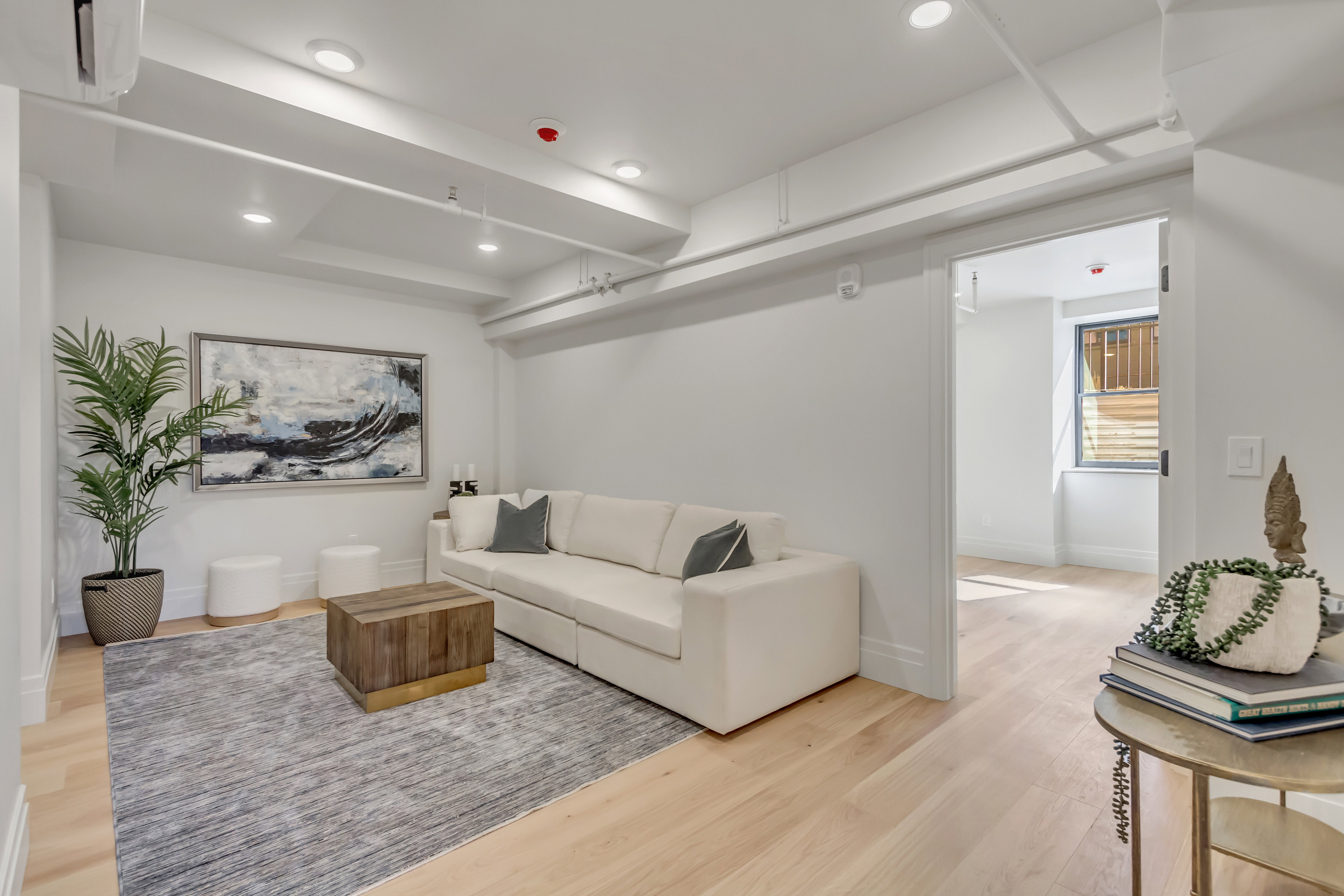 Living room featuring light wood-type flooring and recessed lighting