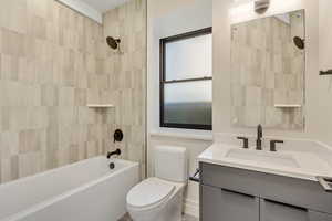 Full bath featuring vanity and shower / tub combination