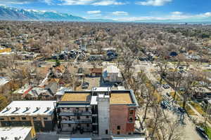 Aerial view of residential area featuring a mountain backdrop