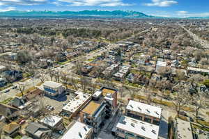 Aerial perspective of suburban area with a mountainous background
