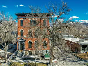 Italianate home with brick siding