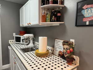 Detailed view of a sink and white microwave