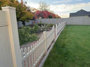 View of fenced backyard