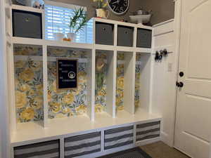 Mudroom with tile patterned floors