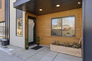 View of exterior entry featuring a patio