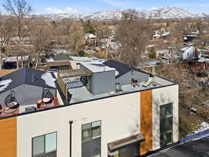 Aerial perspective of suburban area featuring a mountainous background