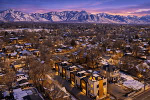 Aerial view of property and surrounding area with mountains