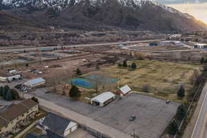 Aerial view of property and surrounding area featuring Kent Smith Memorial Park with Pickleball Courts, soccer fields, and playground.