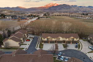 Aerial view at dusk of a mountain view and a residential view