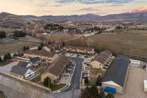 Aerial view at dusk of a residential view and a mountain view