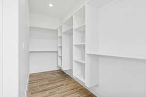 Walk in closet featuring wood tiled floors
