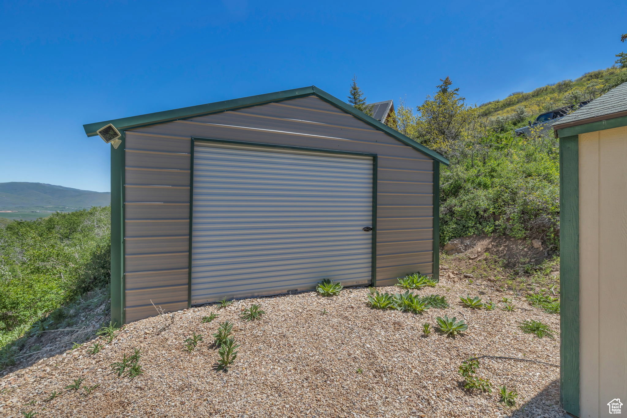 View of outbuilding with a mountain view