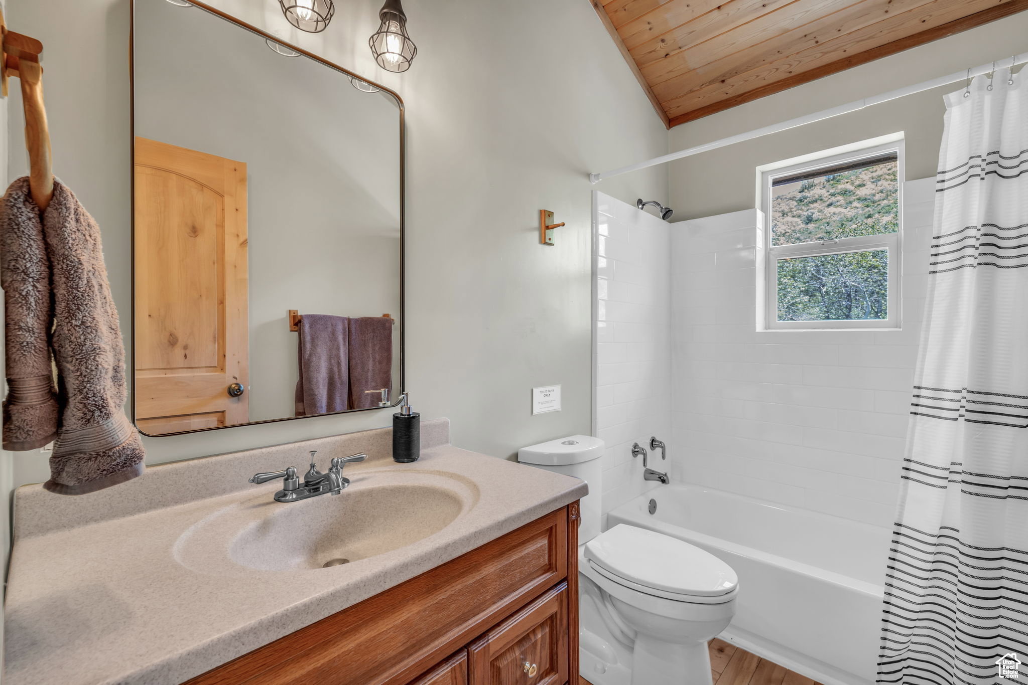 Full bathroom with vanity, shower / bath combination with curtain, and wood ceiling