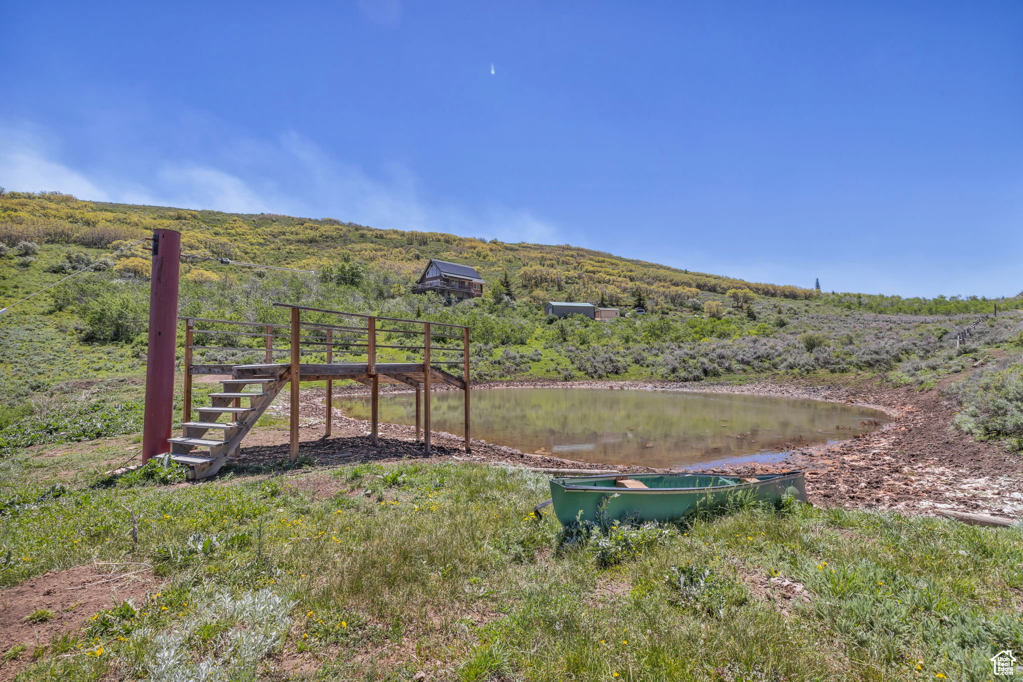 View of yard with a water view and stairway