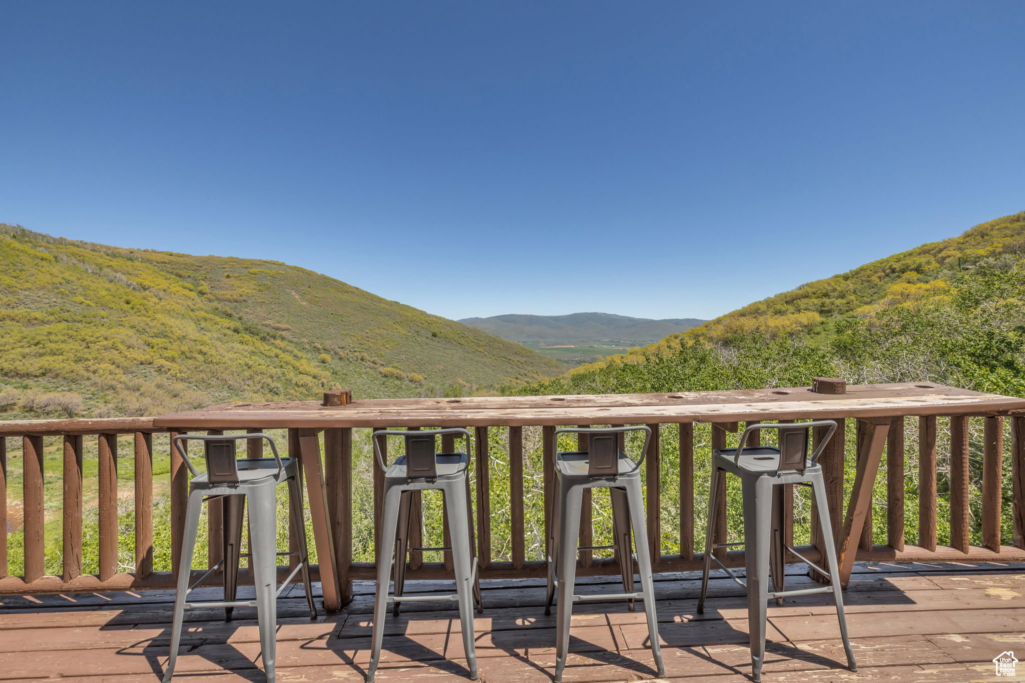 Wooden terrace featuring a mountain view