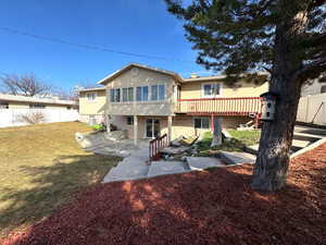 Rear view of property featuring a patio area and stucco siding