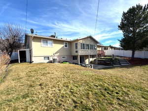 Rear view of property with a patio, stucco siding, and a fenced backyard