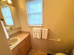 Half bath with vanity and toilet