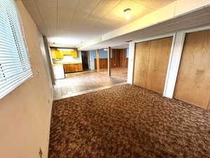 Below grade area featuring light colored carpet