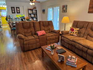 Living area with wood-type flooring and a ceiling fan