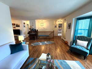 Living room with wood finished floors and baseboards