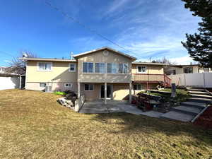 Back of property featuring a patio and stucco siding