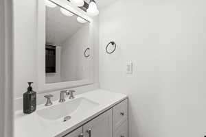 Bathroom with vanity and a textured ceiling