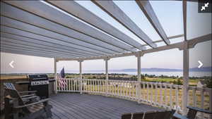 Wooden deck with a grill and a mountain view