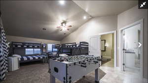 Bedroom featuring vaulted ceiling and ceiling fan
