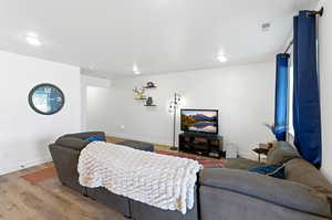 Living room with baseboards and wood finished floors
