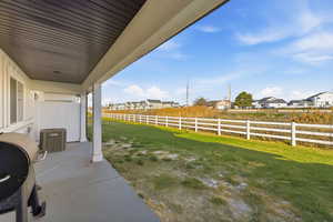 Fenced backyard with a residential view