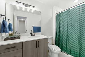 Bathroom with vanity and a shower with curtain