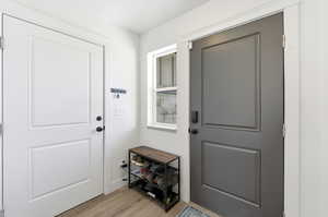 Entryway with wood finished floors