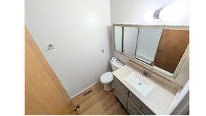 Full bathroom with vanity and light wood-type flooring