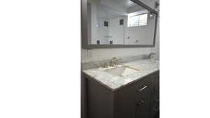 Bathroom with  large mirror, dual sinks