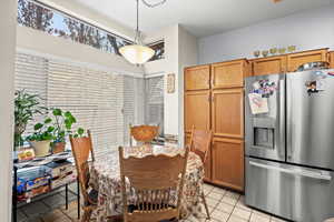 Dining room with light tile patterned floors