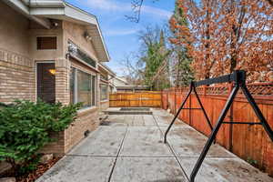 Fenced backyard featuring a patio area